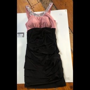 Ruffled dress with jeweled collar.